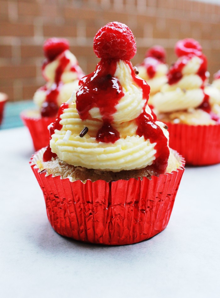 raspberry cupcakes with a white chocolate ganache frosting