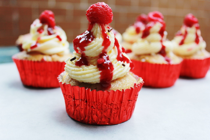 raspberry cupcakes with a white chocolate ganache frosting