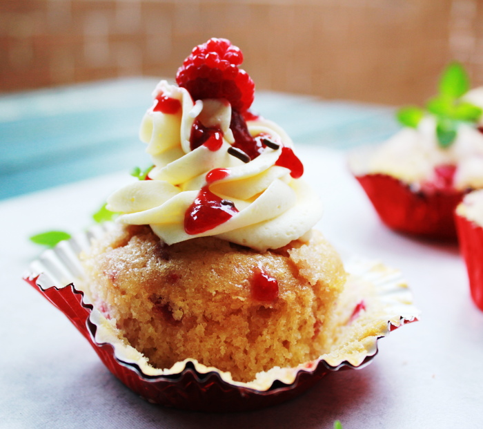 raspberry cupcakes with a white chocolate ganache frosting