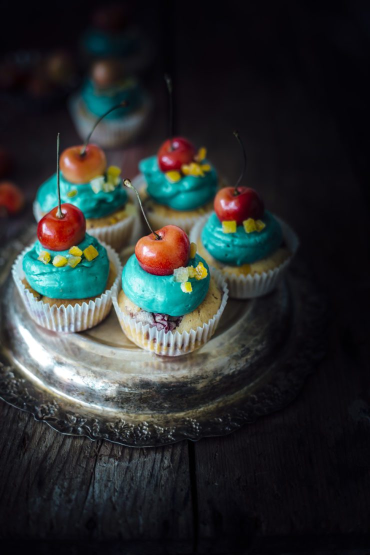 orange cupcakes with cherries