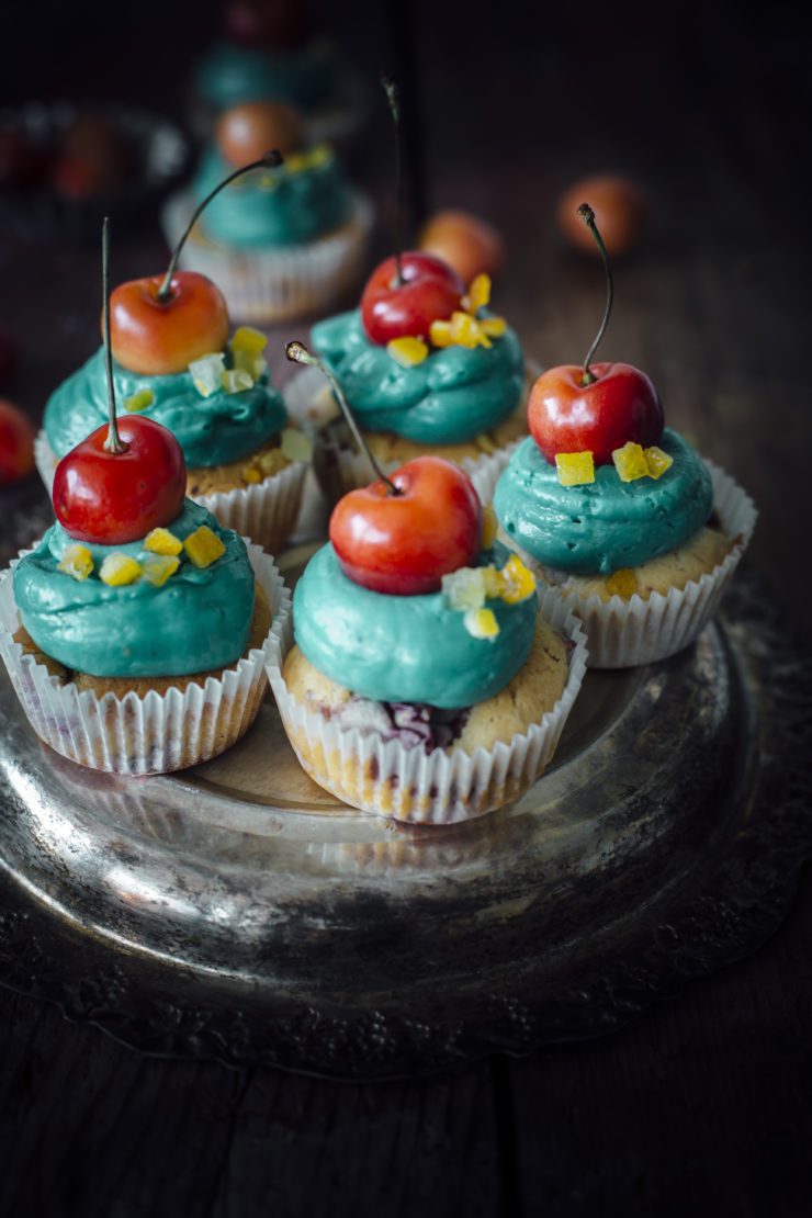 orange cupcakes with cherries