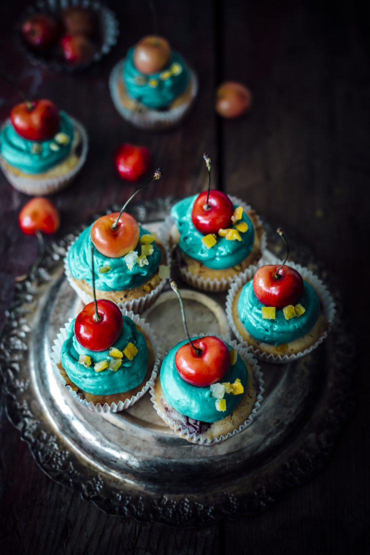 orange cupcakes with cherries