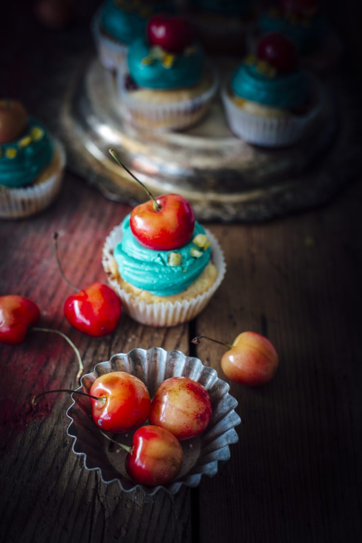 orange cupcakes with cherries