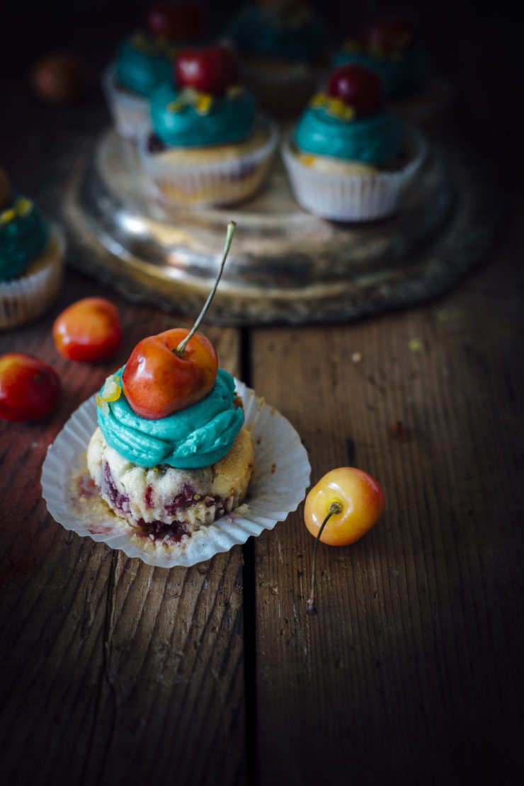 orange cupcakes with cherries